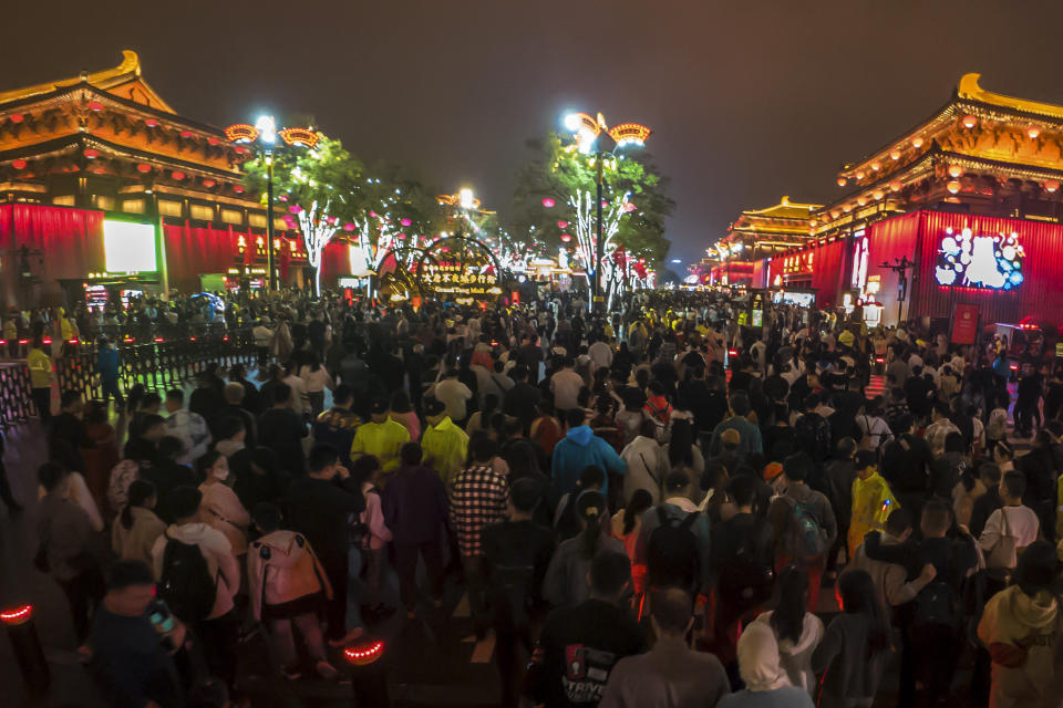 Tourists visit a popular scenic spot in Xi'an in northwest China's Shaanxi province on Oct. 1, 2023. Tourism in China bounced back to pre-pandemic levels during a recent eight-day national holiday, giving a temporary boost to the nation's flagging economy. (Chinatopix via AP)