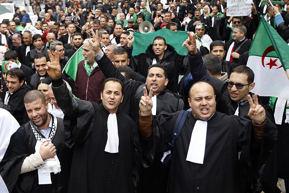 Algerian lawyers march to demand the departure of ailing 82-year-old Algerian President Abdelaziz Bouteflika at the end of his term scheduled on April 28, in Algiers, Saturday, March 23, 2019. The march comes a day after thousands of people demonstrated for the fifth straight Friday since nationwide anti-Bouteflika protests began on Feb. 22.(AP Photo/Anis Belghoul)