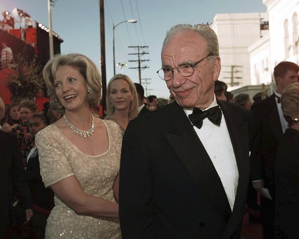 FILE - Rupert Murdoch, accompanied with his wife, Anna Murdoch, arrive to the 70th Academy Awards at the Shrine Auditorium in Los Angeles, Monday, March 23, 1998. (AP Photo/Kevork Djansezian, File)