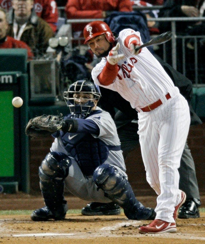 Philadelphia Phillies' Pedro Feliz singles off Tampa Bay Rays relief pitcher Chad Bradford to drive in Eric Bruntlett during the seventh inning of Game 5 of the baseball World Series in Philadelphia. Feliz last at-bats came with the Camden Riversharks.