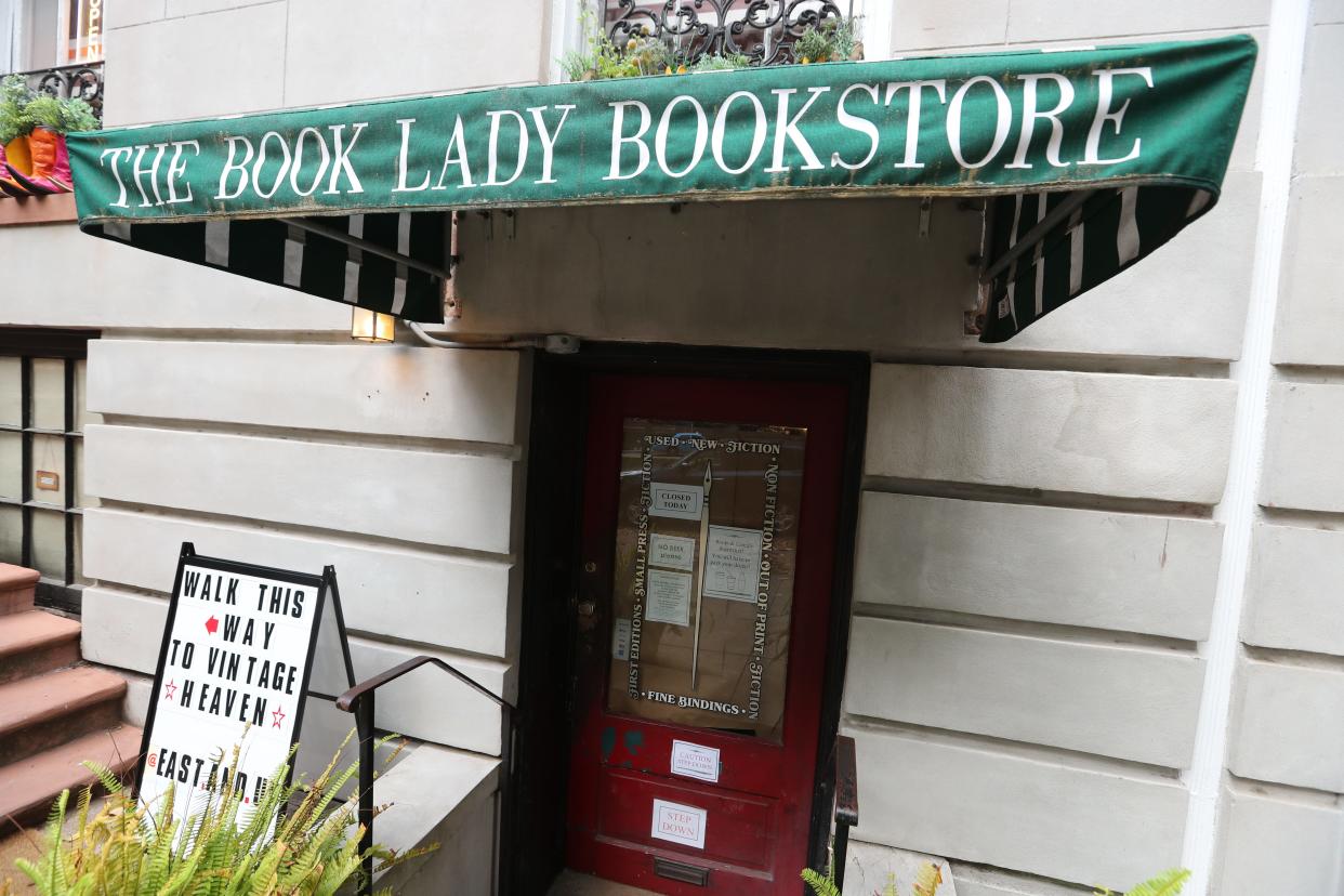 A closed sign is posted on the brown paper covered door at the entrance to The Book Lady Bookstore on Monday, April 22, 2024.