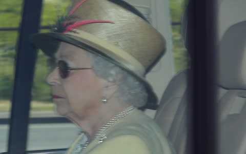 Queen Elizabeth II is driven into Windsor Castle in a Range Rover the day after the royal wedding - Credit: Andrew Matthews /PA