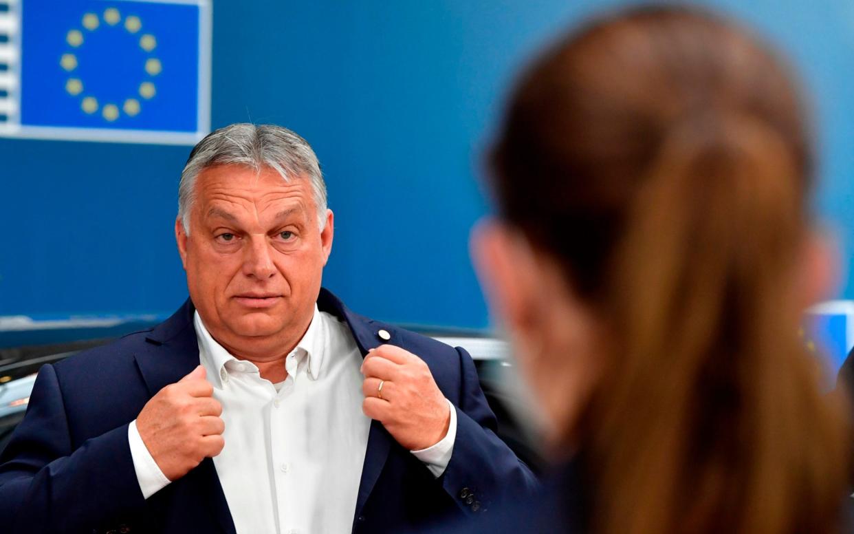 Hungarian Prime Minister Viktor Orban arrives for the EU summit on a coronavirus recovery package in july - JOHN THYS /AFP