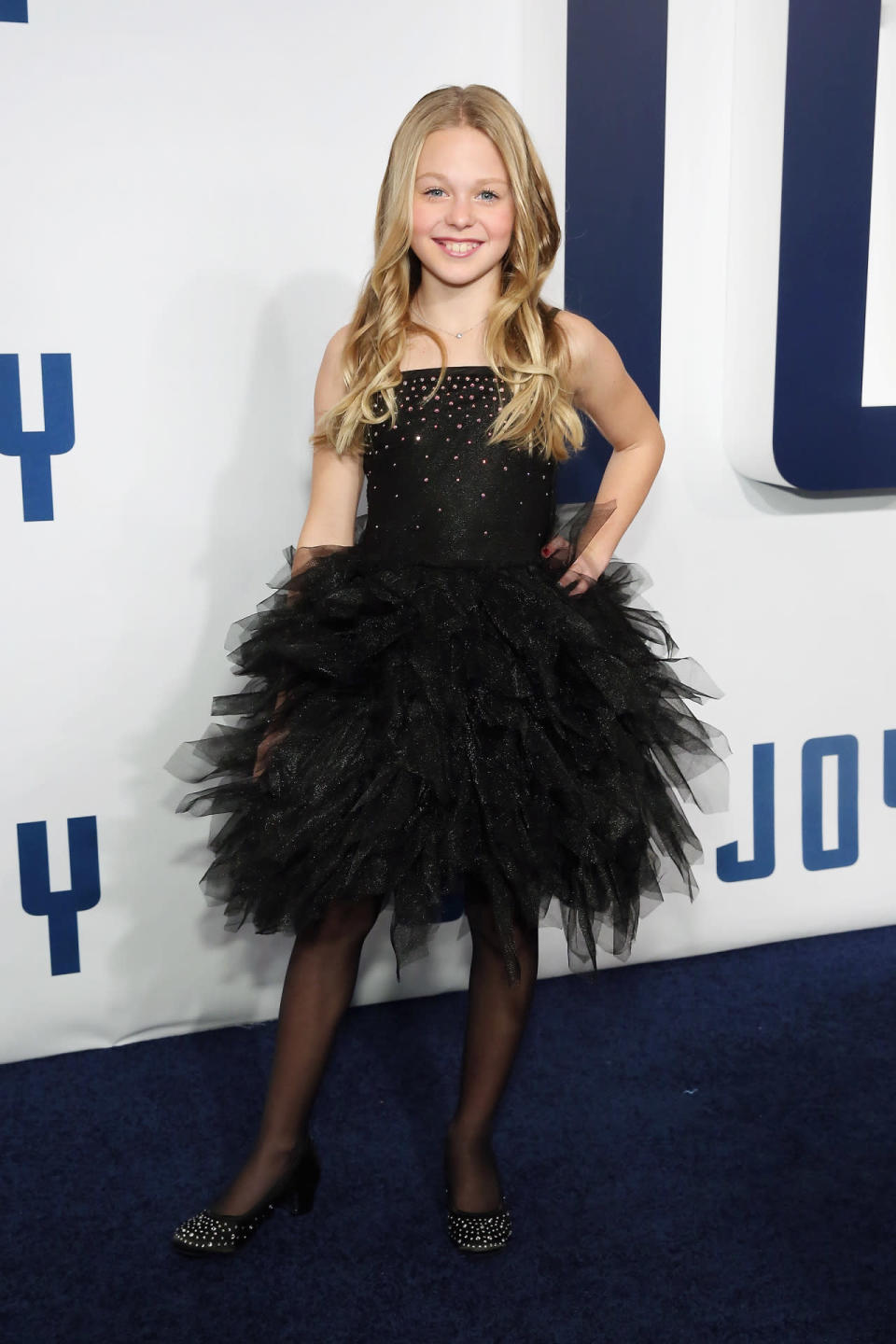 Isabella Crovetti-Cramp in a black tutu dress at the “Joy” premiere in New York City.