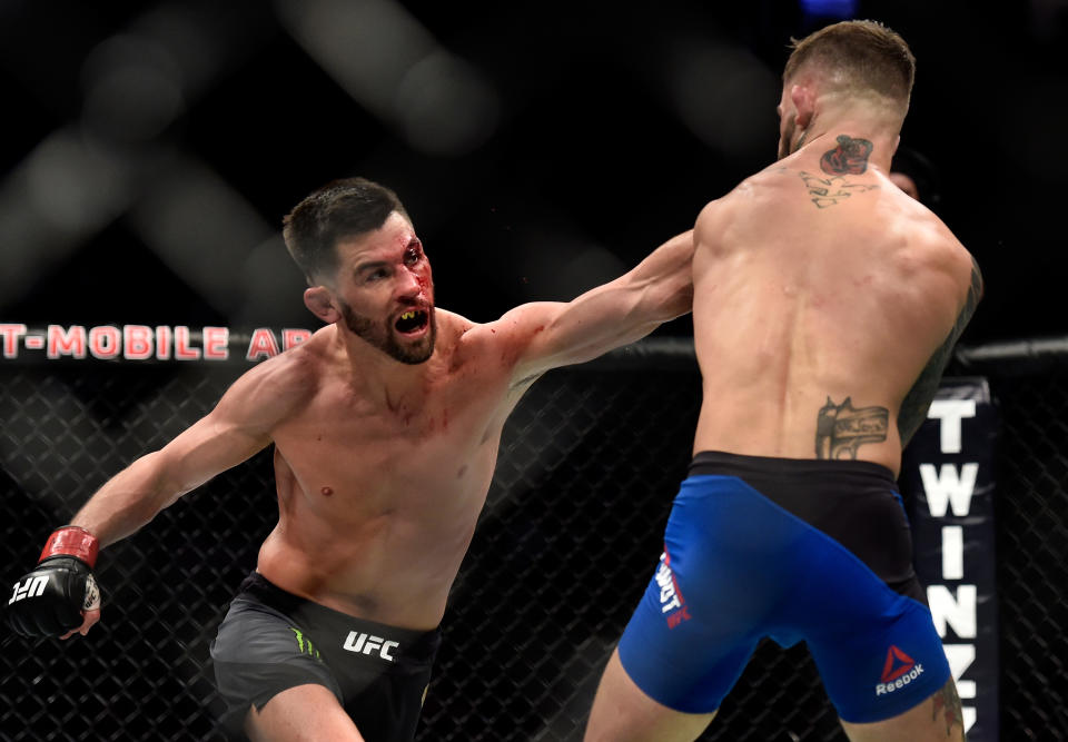 LAS VEGAS, NV - DECEMBER 30:  (L-R) Dominick Cruz punches Cody Garbrandt in their UFC bantamweight championship bout during the UFC 207 event at T-Mobile Arena on December 30, 2016 in Las Vegas, Nevada.  (Photo by Brandon Magnus/Zuffa LLC/Zuffa LLC via Getty Images)