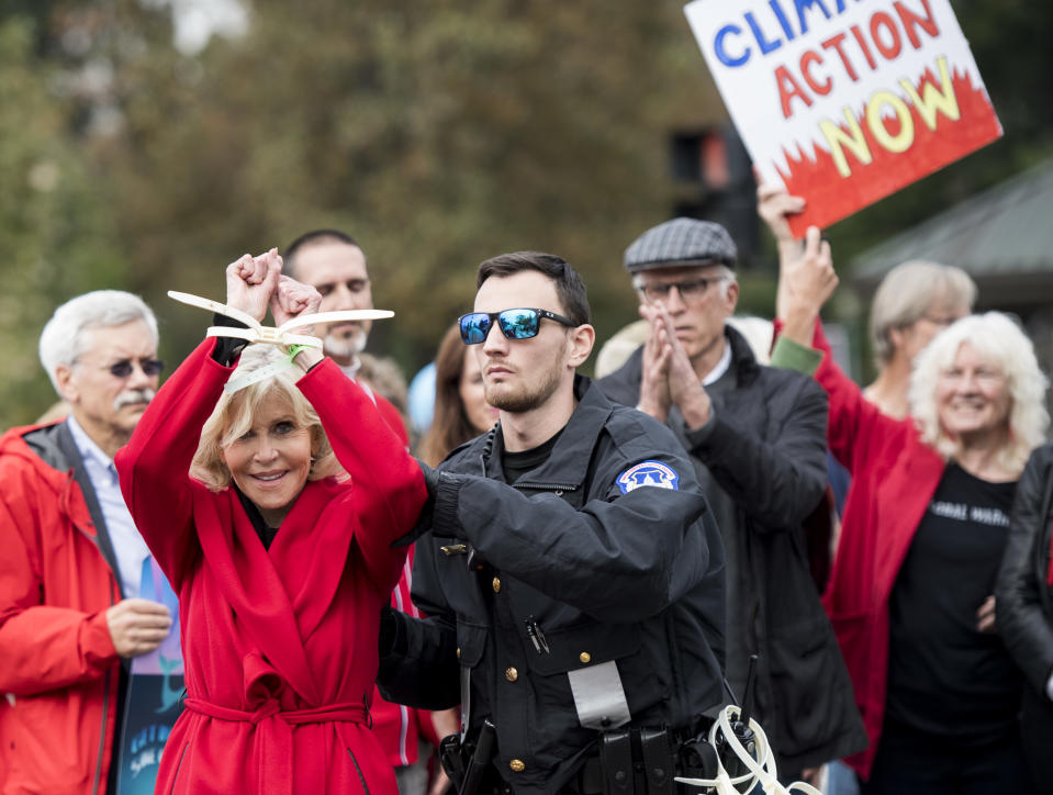 UNITED STATES - OCTOBER 25: Actress Jane Fonda is arrested by U.S. Capitol Police along with Ted Danson and other climate activists after blocking 1st Street in front of the Capitol on Friday, Oct. 25, 2019. The weekly Friday protest calls for action on the Green New Deal. (Photo By Bill Clark/CQ-Roll Call, Inc via Getty Images)