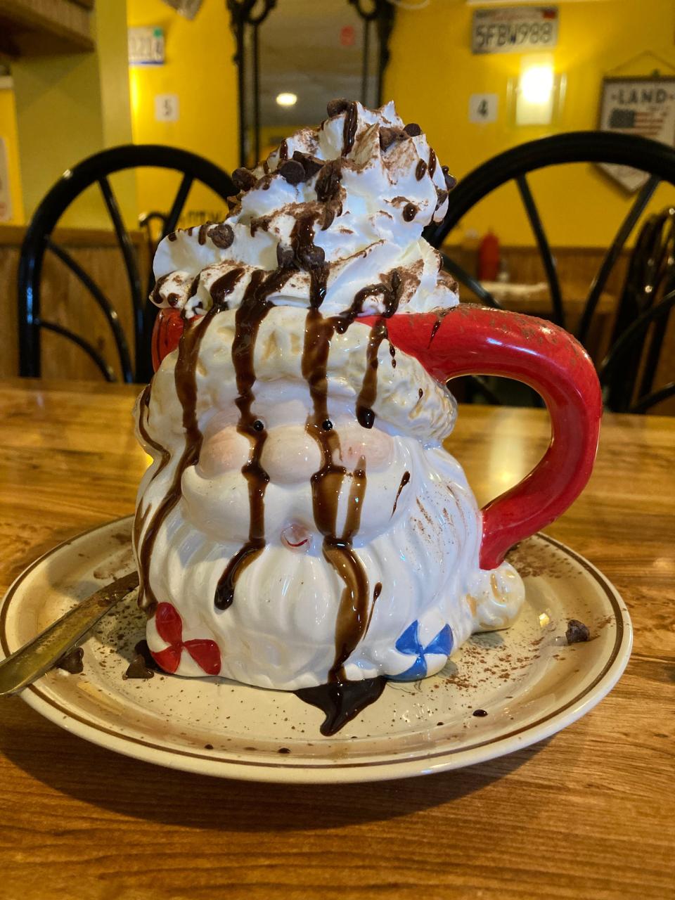 Hot chocolate is served in a festive mug at Fidler's on the Grand on Dec. 16, 2021.