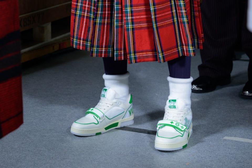 Sneakers and kilts at Louis Vuitton fall ’21 men’s. - Credit: Courtesy of Louis Vuitton