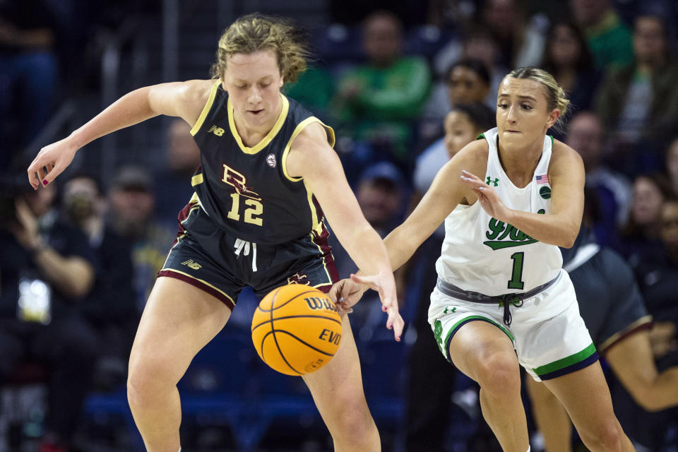 Notre Dame's Dara Mabrey (1) tries to get the ball away from Boston College's Ally VanTimmeren (12) during the first half of an NCAA college basketball game Sunday, Jan. 1, 2023 in South Bend, Ind. (AP Photo/Michael Caterina)