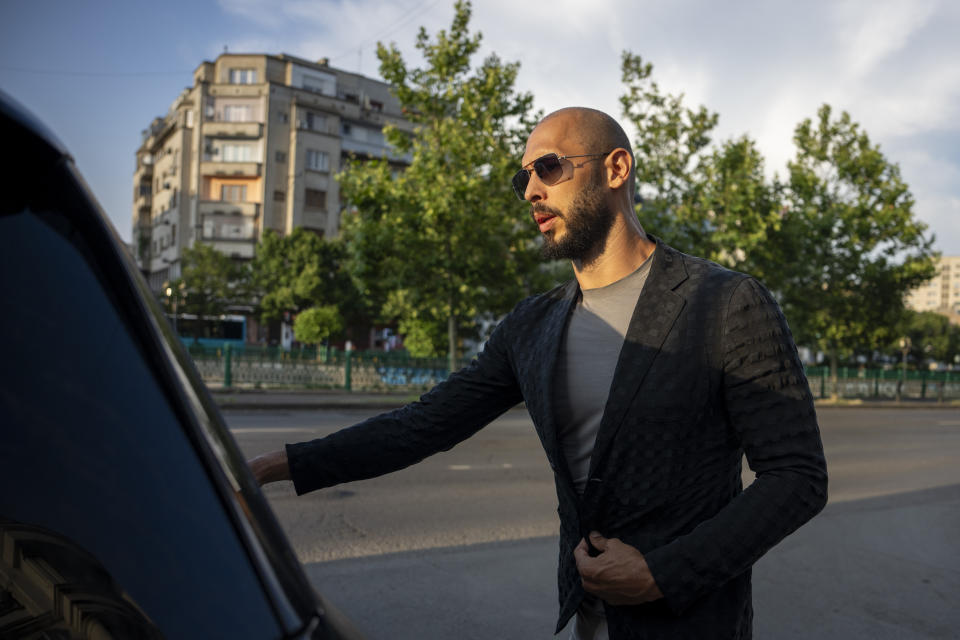 Andrew Tate leaves the Court of Appeal in Bucharest, Romania, Thursday, July 6, 2023. Andrew Tate, the divisive social media personality and former professional kickboxer who is charged in Romania with rape, human trafficking, and forming a criminal gang to sexually exploit women, lost an appeal on Thursday against a court's earlier decision to keep him under house arrest, his spokesperson said. (AP Photo/Andreea Alexandru)