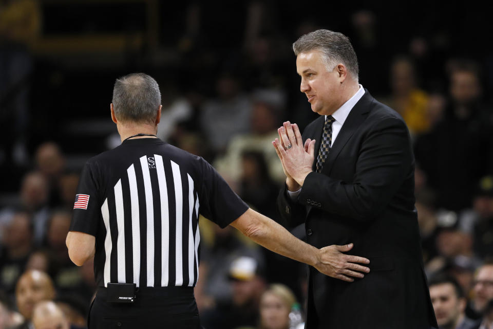 Purdue head coach Matt Painter questions a call against his team during the first half of an NCAA college basketball game against Iowa, Tuesday, March 3, 2020, in Iowa City, Iowa. (AP Photo/Charlie Neibergall)