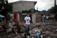 <p>Rene Contreras, 20, a student, poses for a portrait on the rubble of his house after an earthquake in Jojutla de Juarez, Mexico, September 29, 2017. The house was badly damaged. “Now I live with my brother. Tomorrow a good-hearted person will build for me an emergency house. I will fight to get ahead,” Contreras said. (Photo: Edgard Garrido/Reuters) </p>