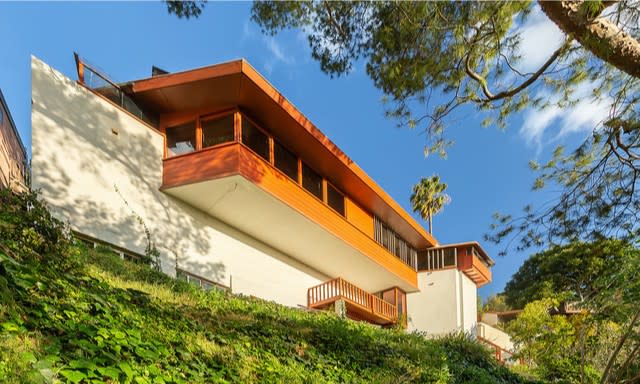 Descending three stories down a hillside lot, the Midcentury home holds three bedrooms in 1,200 square feet.