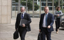 United Kingdom's Brexit advisor David Frost, right, and British Ambassador to the EU Tim Barrow arrive at EU headquarters for a technical meeting on Brexit in Brussels, Wednesday, Sept. 11, 2019. (AP Photo/Virginia Mayo)