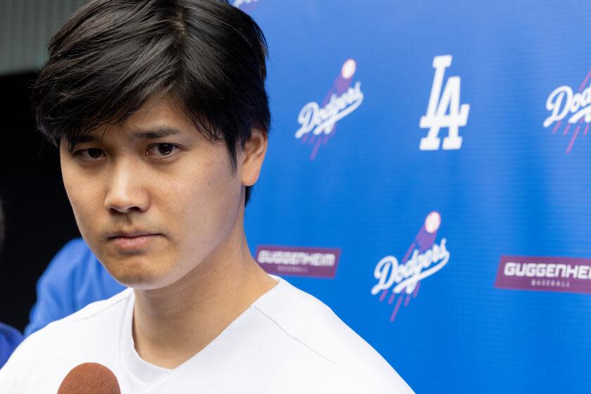 Los Angeles, CA - February 03: Dodger Shohei Ohtani talks with media at DodgerFest 2024, the official kickoff celebration for the upcoming season of Dodger baseball at Dodger Stadium on Saturday, Feb. 3, 2024 in Los Angeles, CA. (Brian van der Brug / Los Angeles Times)