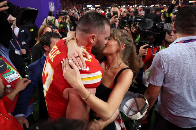 <p>Ezra Shaw/Getty</p> Chiefs player Travis Kelce kisses girlfriend Taylor Swift after defeating the San Francisco 49ers during Super Bowl LVIII on Feb. 11, 2024