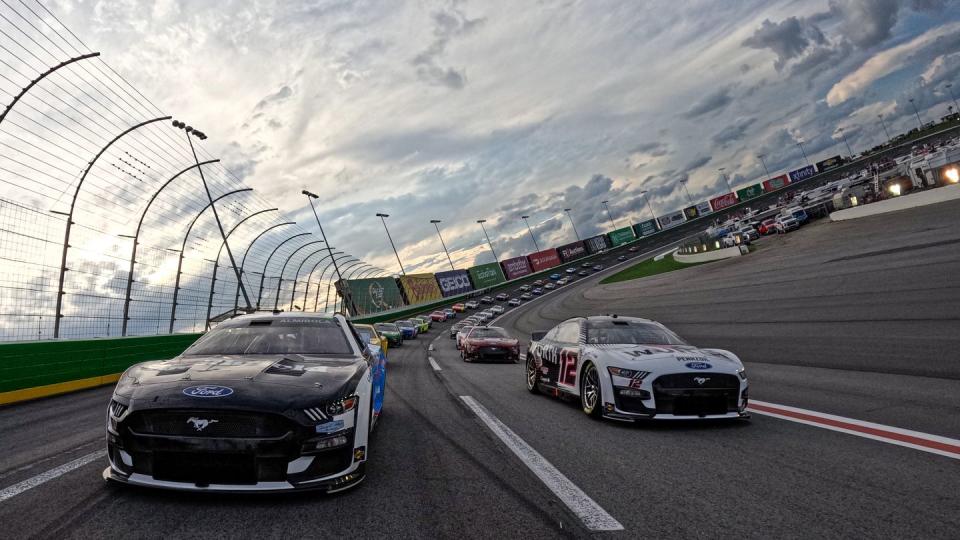 hampton, georgia july 09 aric almirola, driver of the 10 smithfieldihop ford, and ryan blaney, driver of the 12 wurth ford, lead the field on a pace lap prior to the nascar cup series quaker state 400 available at walmart at atlanta motor speedway on july 09, 2023 in hampton, georgia photo by chris graythengetty images