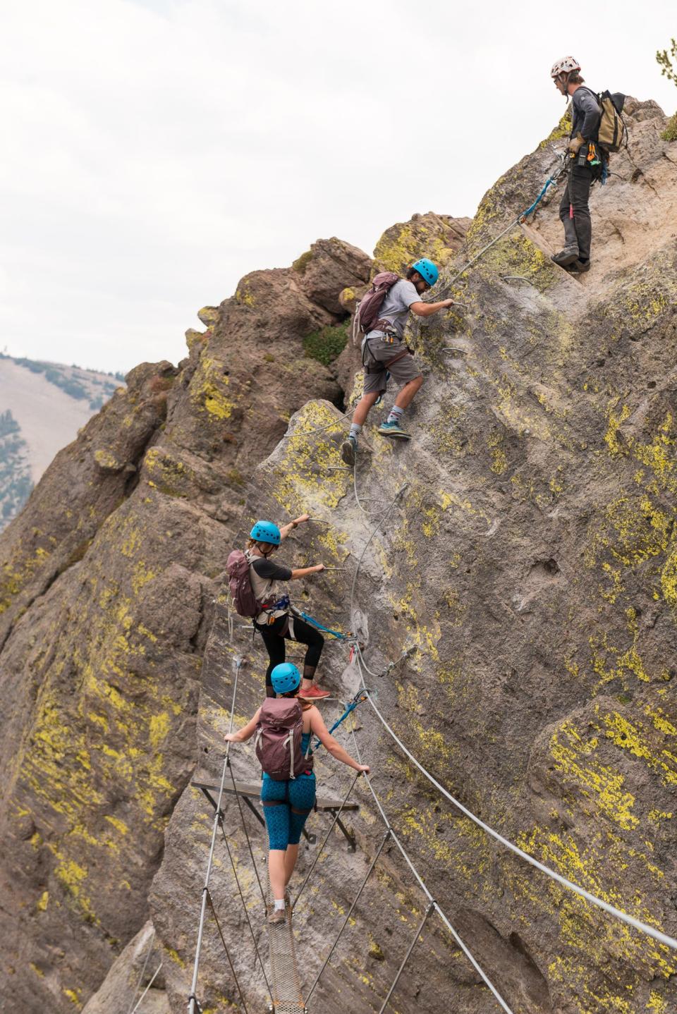 Visitors walk along the via ferrata route at Mammoth Mountain in Mammoth Lakes, Calif.