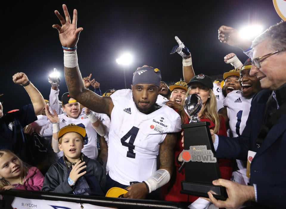 Georgia Southern Eagles quarterback Shai Werts (4) receives the MVP award after his team defeated the Eastern Michigan Eagles at Cramton Bowl Stadium in Montgomery, Ala., on Dec. 15, 2018.