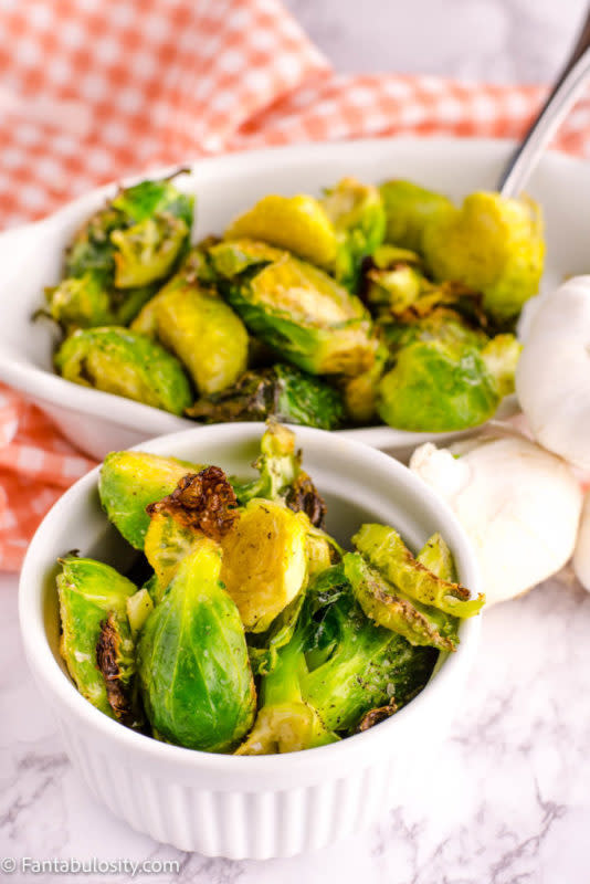 <p>Roasted brussels sprouts are a staple side dish in our home. Simply seasoned with olive oil, garlic powder, salt, and pepper, this easy recipe goes great with any main dish!</p><p><strong>Get the recipe:</strong> <a href="https://fantabulosity.com/roasted-brussels-sprouts/" rel="nofollow noopener" target="_blank" data-ylk="slk:Roasted Brussels Sprouts;elm:context_link;itc:0;sec:content-canvas" class="link "><strong>Roasted Brussels Sprouts</strong></a></p>