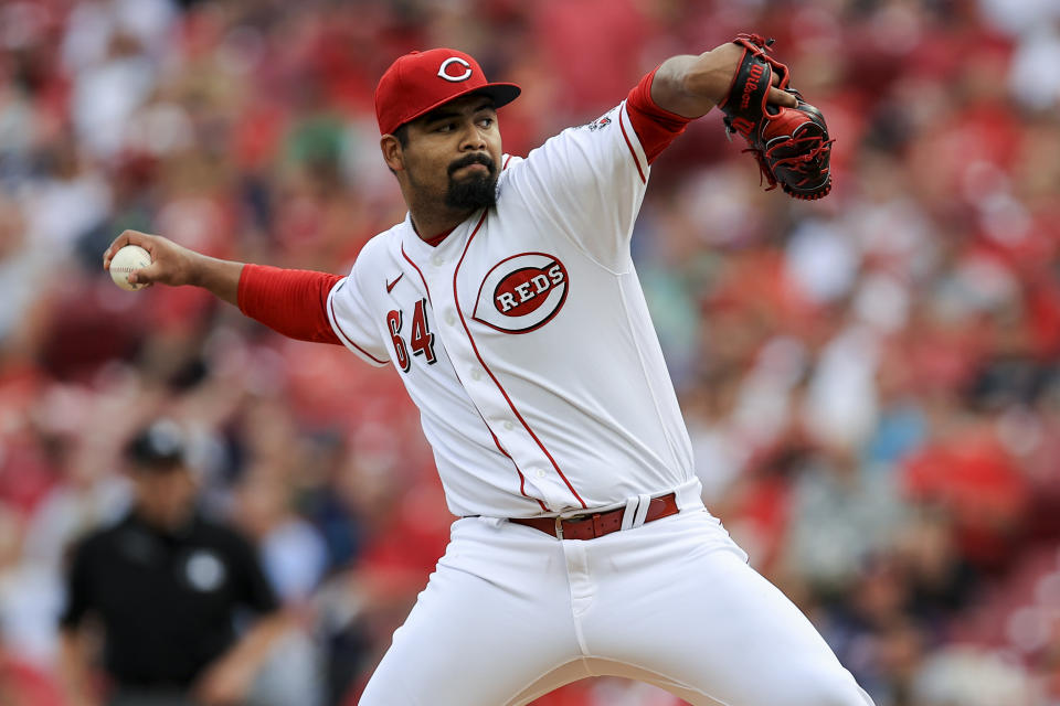 Cincinnati Reds' Tony Santillan throws during the first inning of a baseball game against the Atlanta Braves in Cincinnati, Thursday, June 24, 2021. (AP Photo/Aaron Doster)