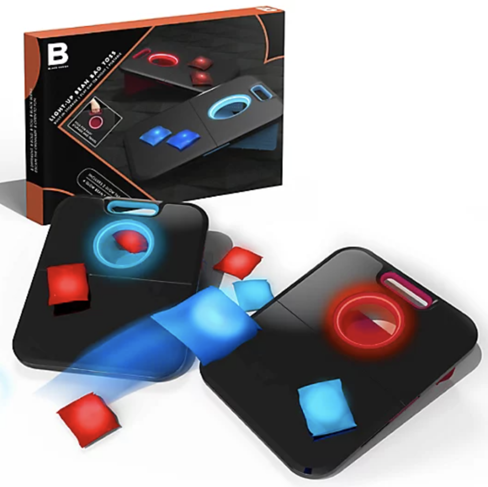Black Series LED Game Bean Bag Toss Game with black panels and red and blue bean bags (Photo via Bed Bath & Beyond)