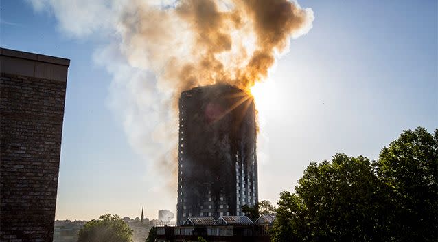 Smoke continues to pour from the building. Photo: AAP