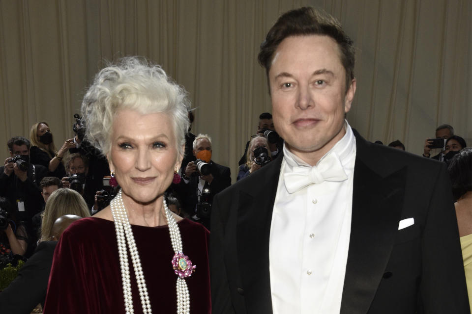 FILE - Maye Musk, left, and her son, Elon Musk, attend The Metropolitan Museum of Art's Costume Institute benefit gala celebrating the opening of the "In America: An Anthology of Fashion" exhibition on Monday, May 2, 2022, in New York. Many people are puzzled on what a Elon Musk takeover of Twitter would mean for the company and even whether he’ll go through with the deal. If the 50-year-old Musk’s gambit has made anything clear it’s that he thrives on contradiction. (Photo by Evan Agostini/Invision/AP, File)