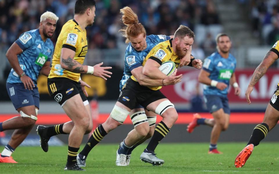 The Blues and Hurricanes in action in Super Rugby Aotearoa - AFP