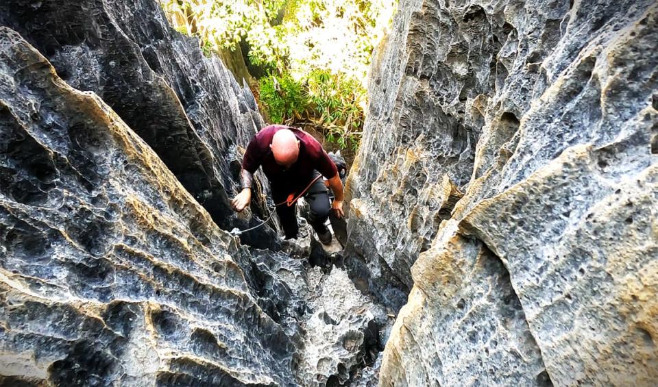 <div class="inline-image__caption"><p>Climbing to the peak of Tsingy de Bemaraha</p></div> <div class="inline-image__credit">Jody Ray</div>