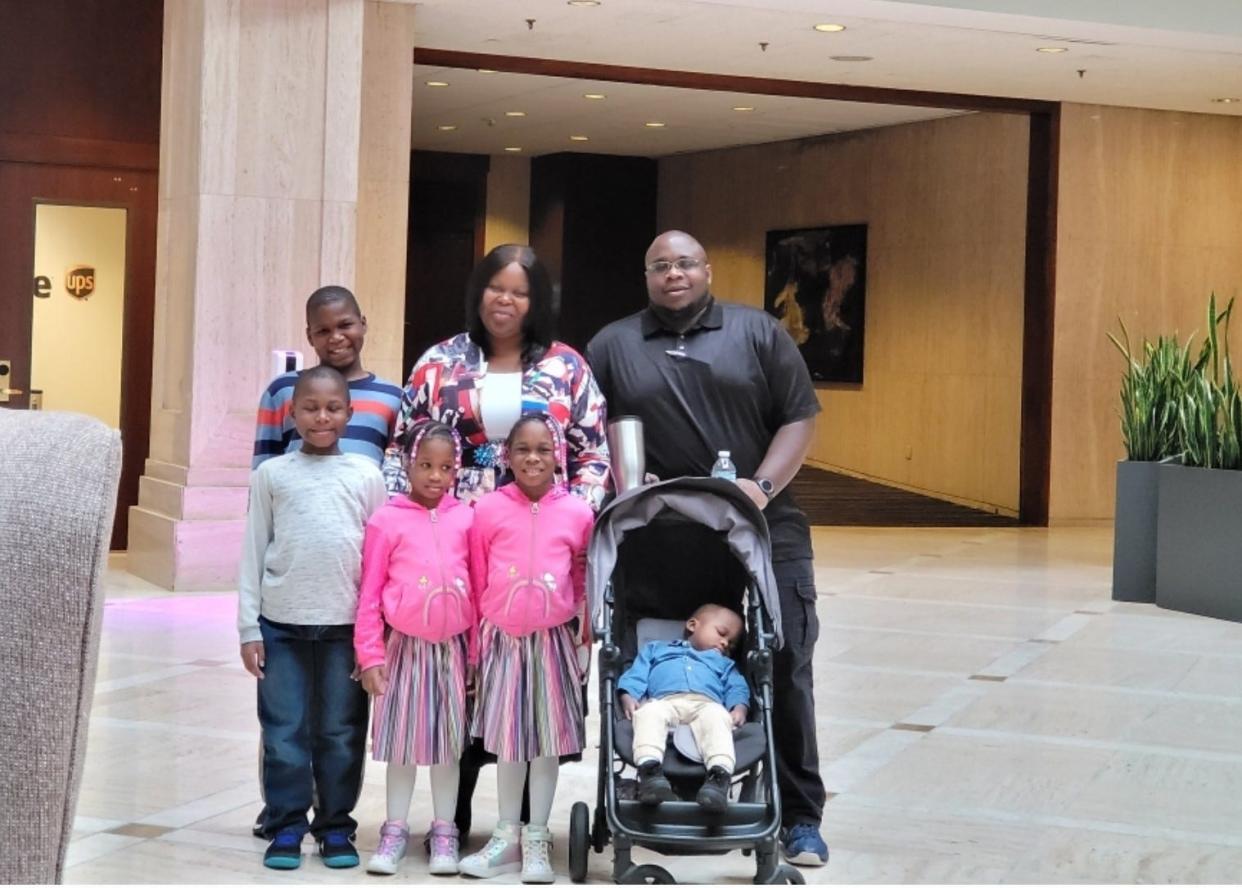 Rainey Richardson's family received increased Child Tax Credit payments in 2021. She's pictured with her husband, Derric, and five children.