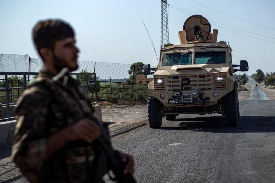 A fighter of the Syrian Democratic Forces (SDF) stands guard along a road in Syria's northeastern on September 4, 2023. The US military teamed up with the SDF to capture an Isis leader who helped detainees escape (AFP via Getty Images)