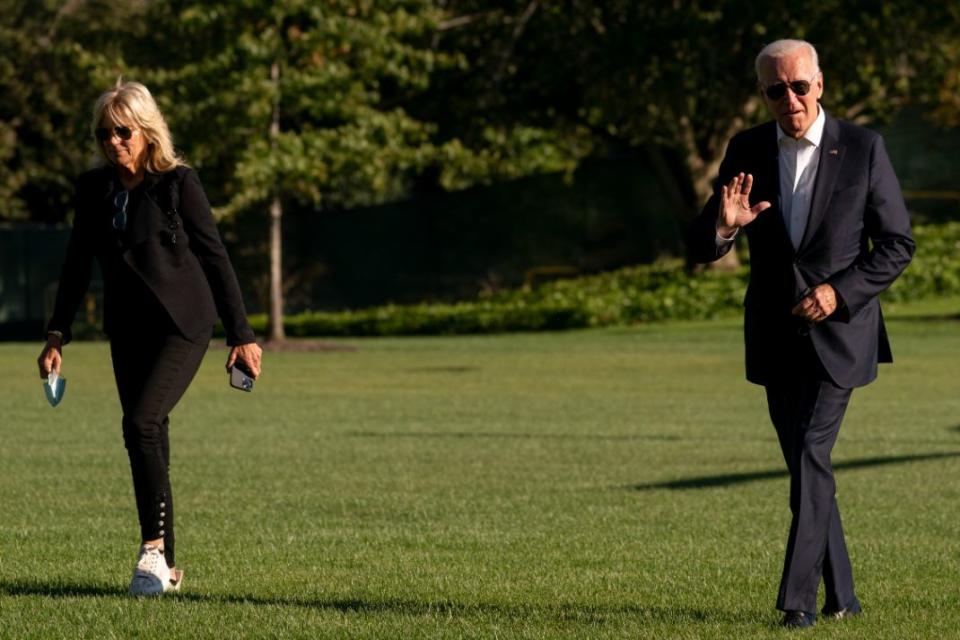 Jill Biden and President Joe Biden arrive at the White House in Washington, Sunday, Sept. 26, 2021, after returning from a weekend at Camp David. - Credit: AP