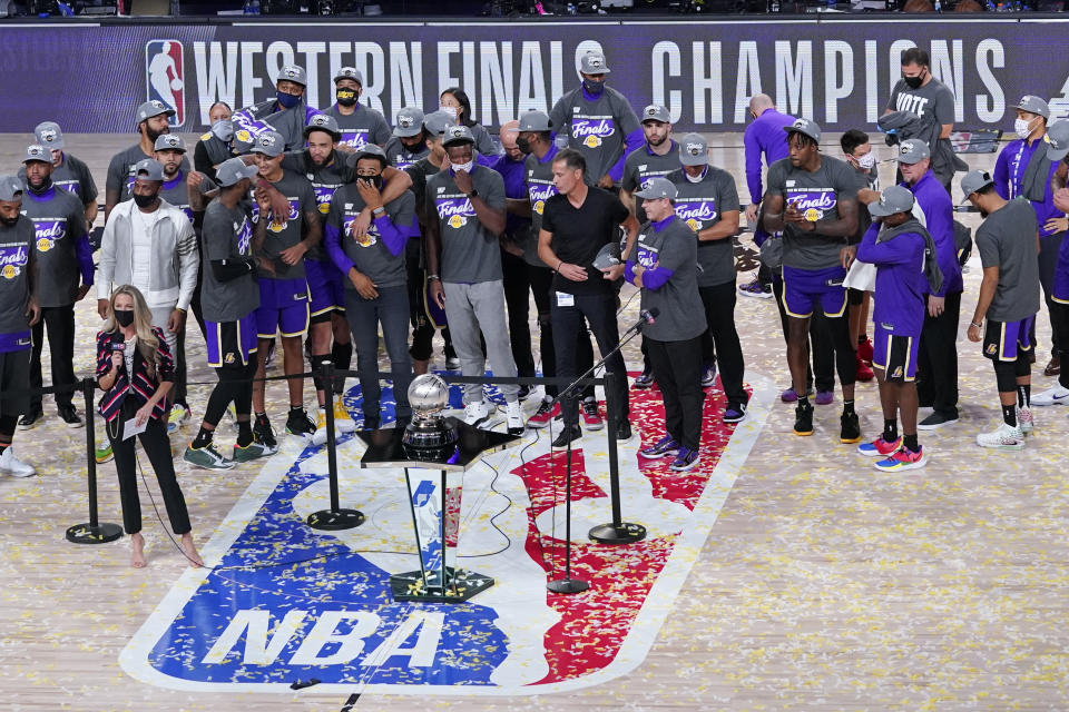 The Los Angeles Lakers celebrate after beating the Denver Nuggets in an NBA conference final playoff basketball game Saturday, Sept. 26, 2020, in Lake Buena Vista, Fla. The Lakers won 117-107 to win the series 4-1. (AP Photo/Mark J. Terrill)