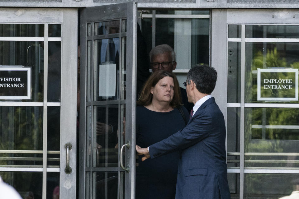 Bruce Brown, right, executive director of the Reporters Committee for Freedom of the Press, followed by Washington Post Executive Editor Sally Buzbee, and others come out to speak with reporters after a meeting with Attorney General Merrick Garland at the Department of Justice, Monday, June 14, 2021, in Washington. (AP Photo/Alex Brandon)