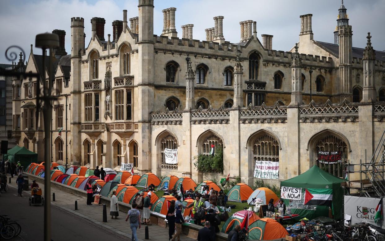 Students gather around tents during a pro-Palestine protest at Kings College, Cambridge University