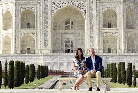 Britain's Prince William and his wife Catherine, the Duchess of Cambridge, pose as they sit in front of the Taj Mahal in Agra, April 16, 2016. REUTERS/Money Sharma/Pool