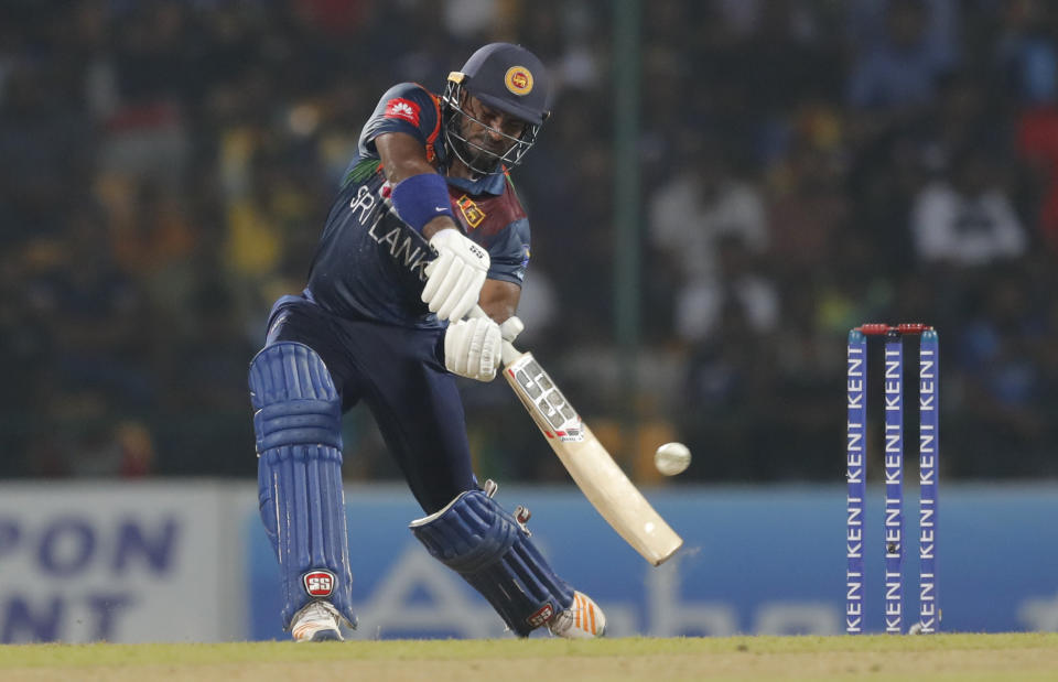Sri Lanka's Kusal Perera plays a shot during their first Twenty20 cricket match with West Indies in Pallekele, Sri Lanka, Wednesday, March 4, 2020. (AP Photo/Eranga Jayawardena)