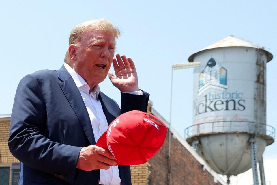 Former President Donald Trump gestures on the day of his "Make America Great Again" rally in Pickens, South Carolina