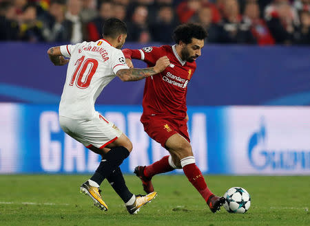 Soccer Football - Champions League - Sevilla vs Liverpool - Ramon Sanchez Pizjuan, Seville, Spain - November 21, 2017 Liverpool's Mohamed Salah in action with Sevilla’s Ever Banega Action Images via Reuters/Matthew Childs