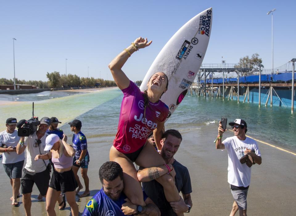 Johanne Defay is carried on friends' shoulders after winning the Jeep Surf Ranch Pro women's event.