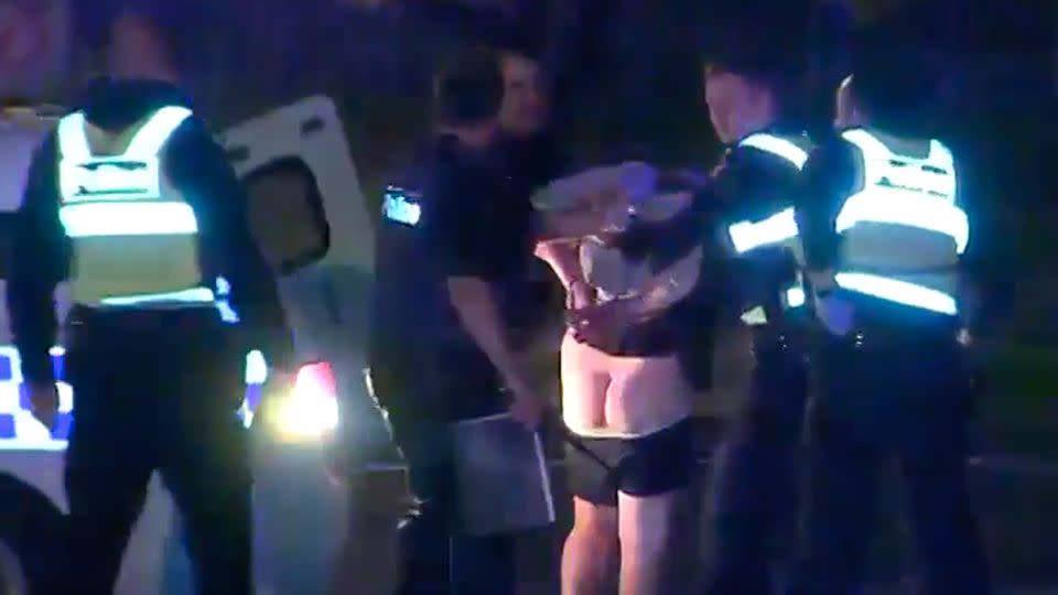 Police took the 41-year-old into custody outside the apartment block. Source: 7 News