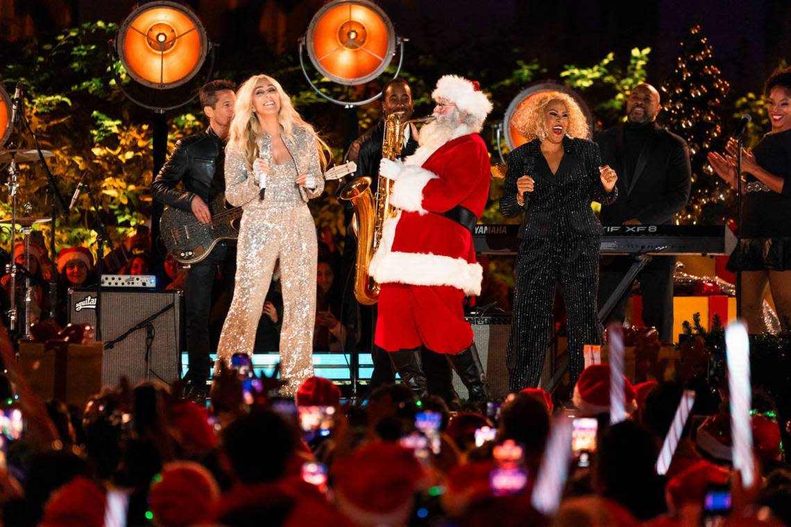 Cher and Darlene Love sing with a Santa playing a saxaphone during “Christmas in Rockefeller Center” on NBC. NBC/Ralph Bavaro/NBC