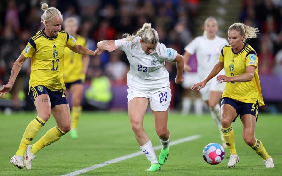 Alessia Russo scores their side's third goal whilst under pressure from Caroline Seger and Jonna Andersson of Sweden - Getty Images