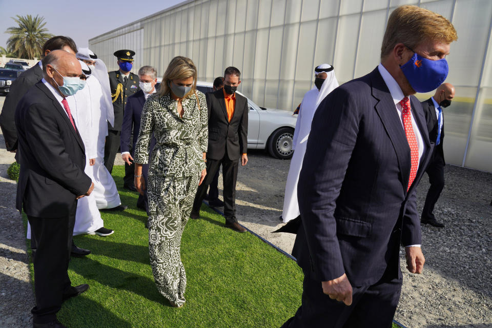King Willem-Alexander and Queen Maxima visit the Pure Harvest strawberry farm near Sweihan in Abu Dhabi, United Arab Emirates, Wednesday, Nov. 3, 2021. King Willem-Alexander and Queen Maxima of the Netherlands are in the United Arab Emirates as part of a royal trip to the country to visit Dubai's Expo 2020. (AP Photo/Jon Gambrell)