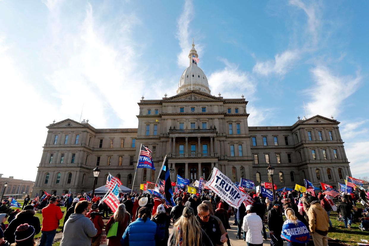 People gather at the Michigan State Capitol for a “Stop the Steal” rally in support of US President Donald Trump on 14 November, 2020 (AFP via Getty Images)