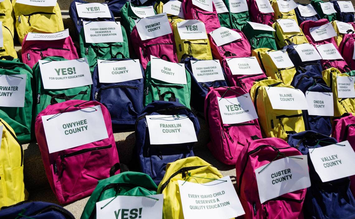 Backpacks filled with signature forms from Idaho counties lined the steps of the Capitol during a press conference by Reclaim Idaho announcing their collection of more than 100,000 signatures for their Quality Education Act initiative.
