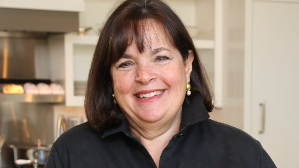 a photo of ina garten smiling in her kitchen