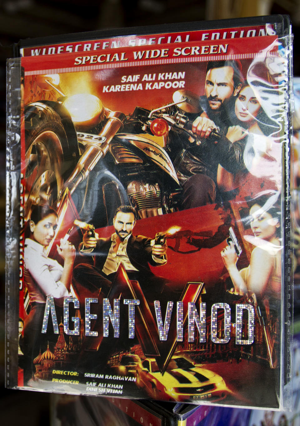 Newly released Bollywood film 'Agent Vinod' is display for sale at a movie store in Rawalpindi, Pakistan, on Monday, March 26, 2012. The Indian James Bond, Agent Vinod, can disarm a bomb while flying a helicopter, dodge bullets from deadly assassins and save his country from nuclear disaster, but getting into cinemas in Pakistan has proved to be an impossible feat, after Agent Vinod's critical portrayal of the country's generals and spies and shows Pakistan providing support for the Taliban in Afghanistan. (AP Photo/Anjum Naveed)