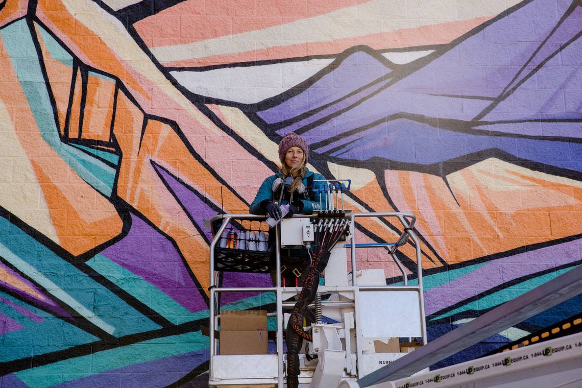 Gretchen Leggitt at her Three Sisters Mural in 2021 in Bend, Oregon.
